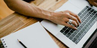 person typing on a laptop via unsplash